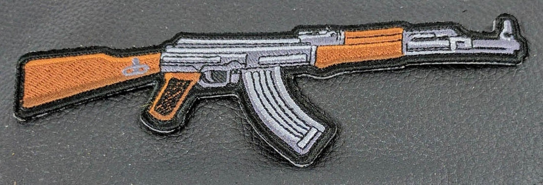 Close-up of AK-47 embroidered patch threadwork, magazine and merrowed edge