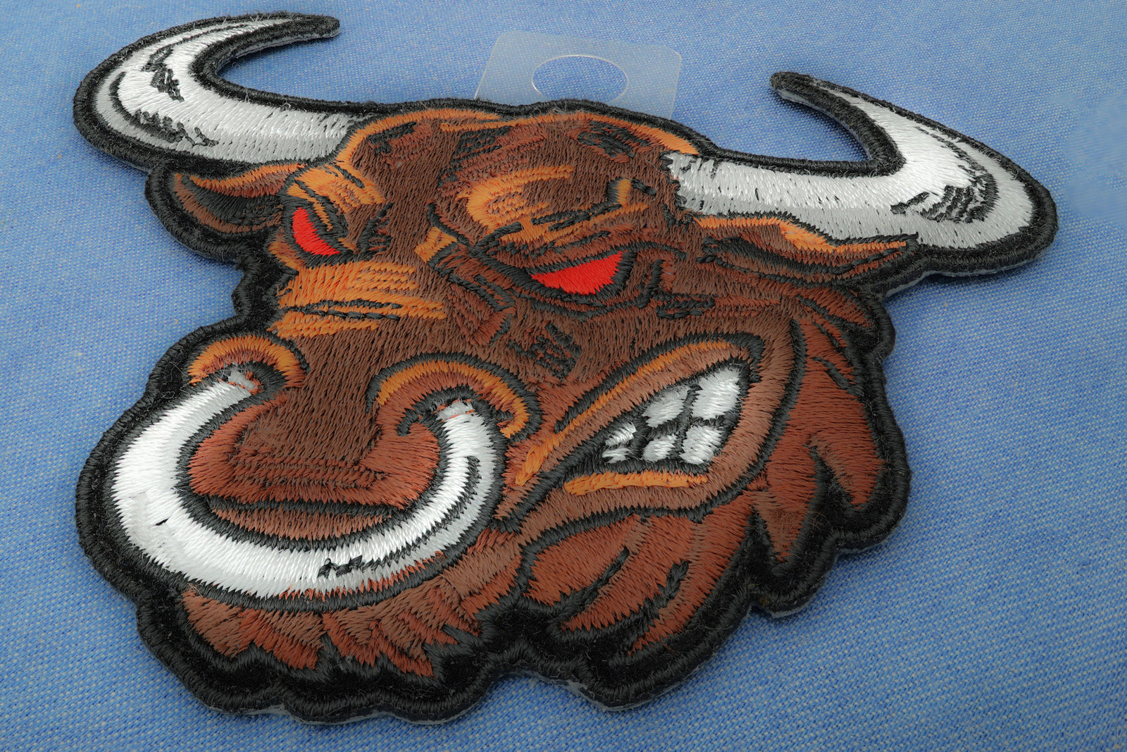 Angry Bull Embroidered Patch shown for scale
