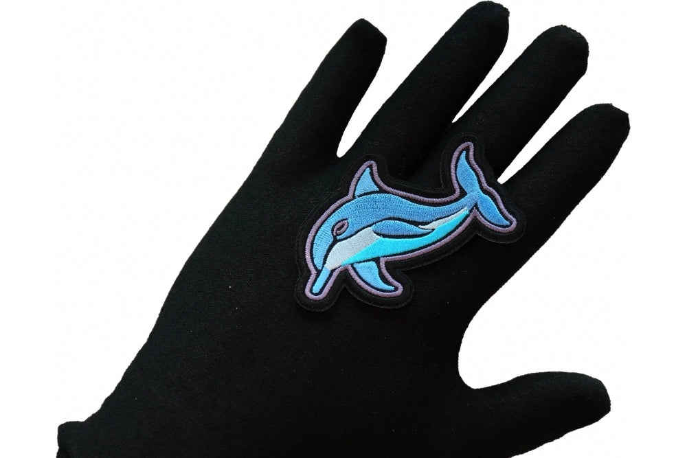 Dolphin Embroidered Patch shown for scale