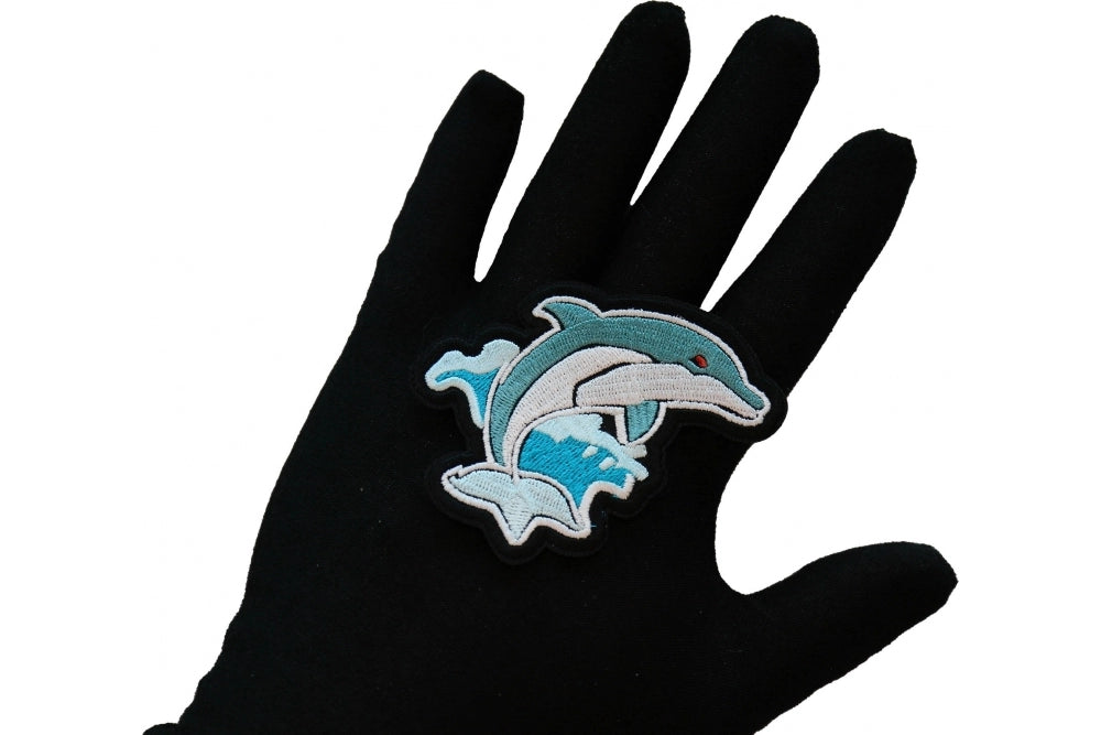 Ocean Dolphin embroidered patch shown for scale
