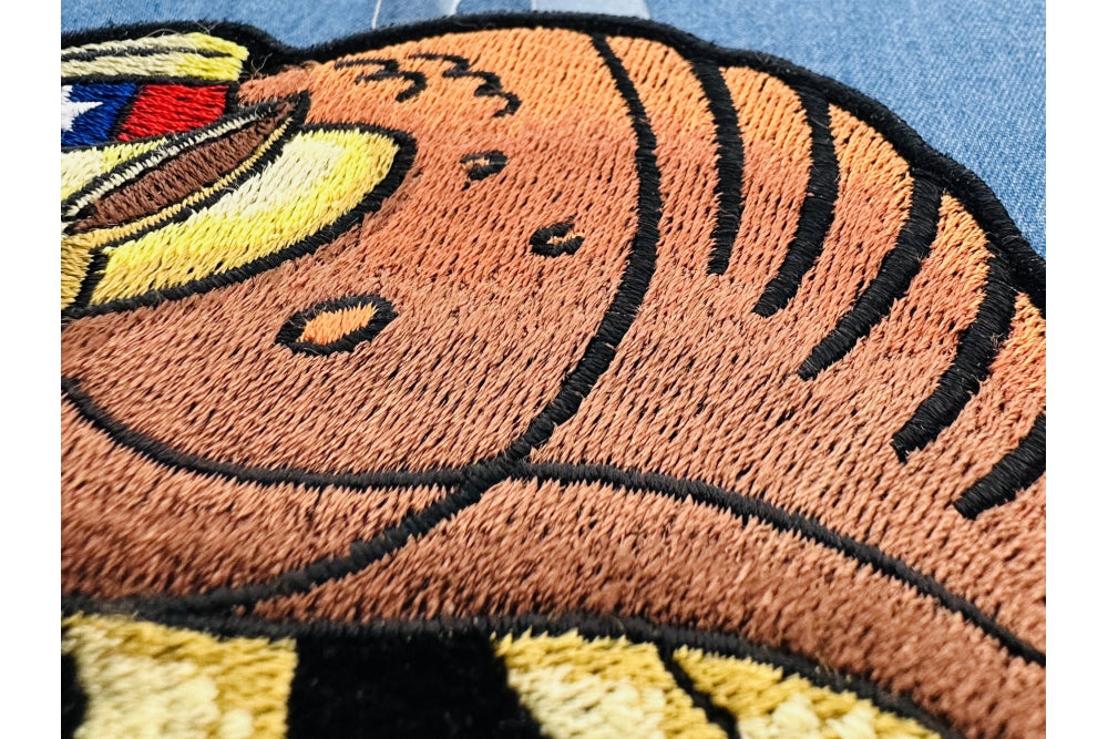 Texas Armadillo Embroidered Patch shown for scale