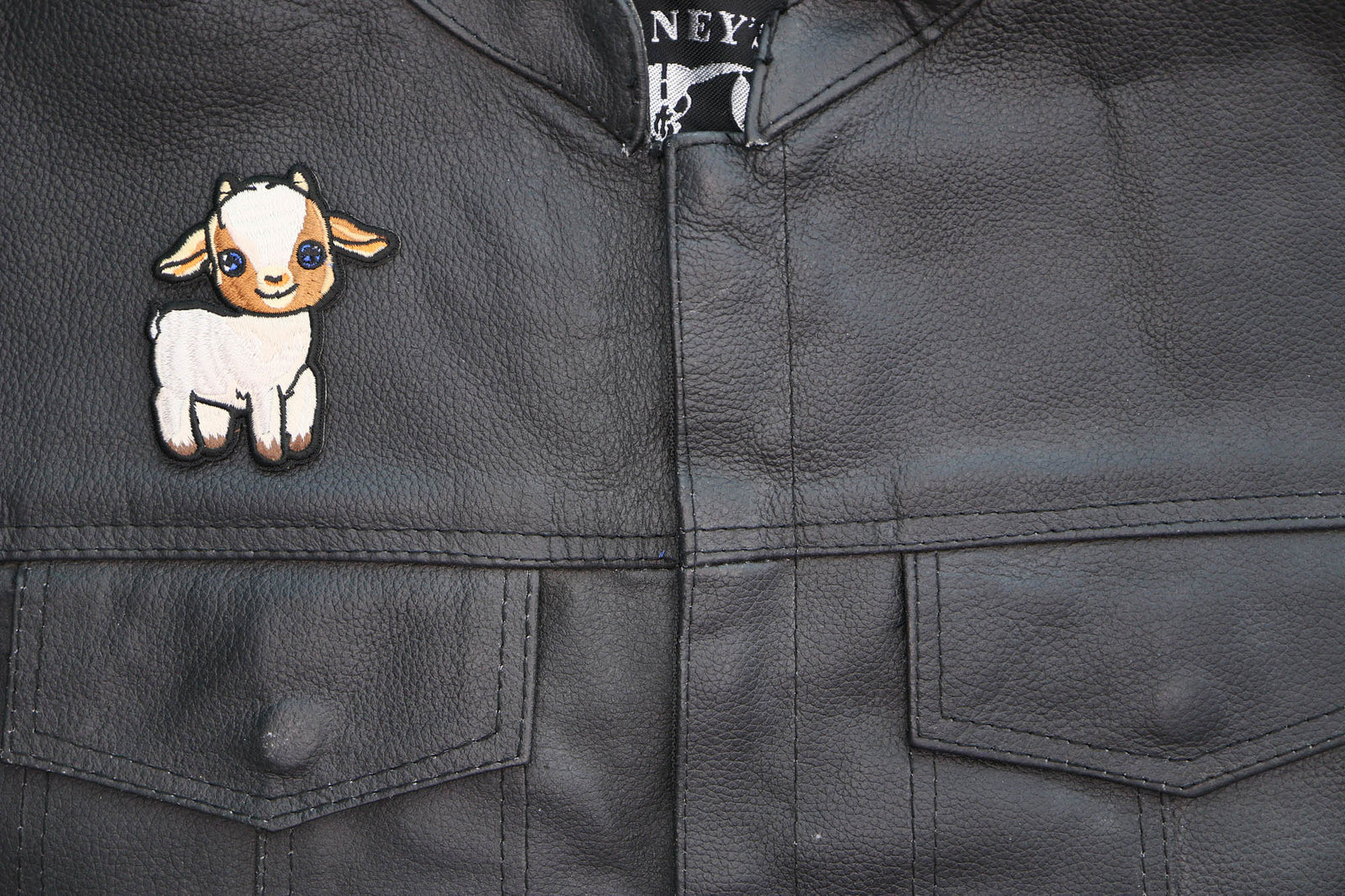 Baby Goat Embroidered Patch shown for scale