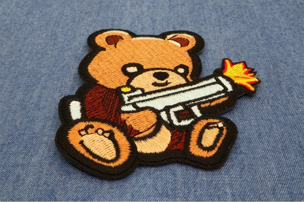 Armed Bear Machine Gun Embroidered Patch shown for scale