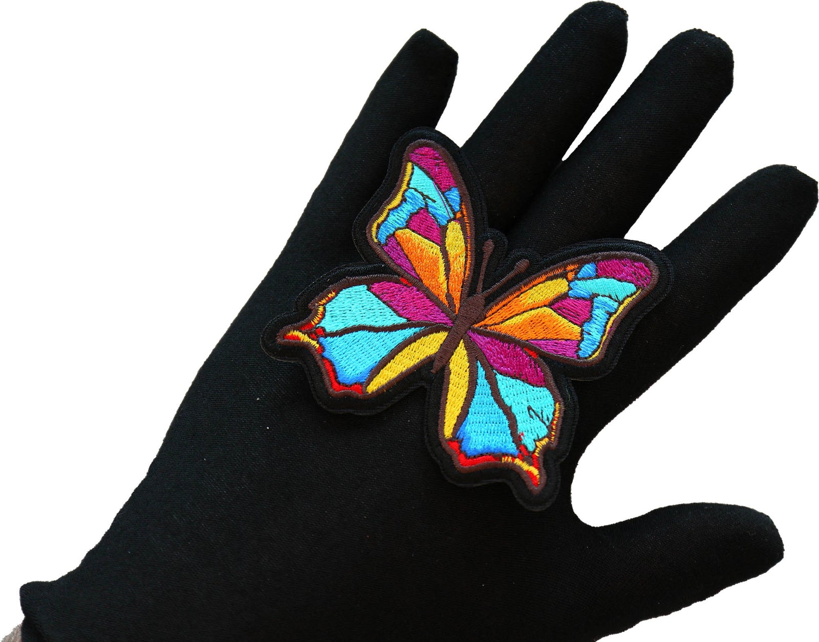 Butterfly embroidered patch shown for scale