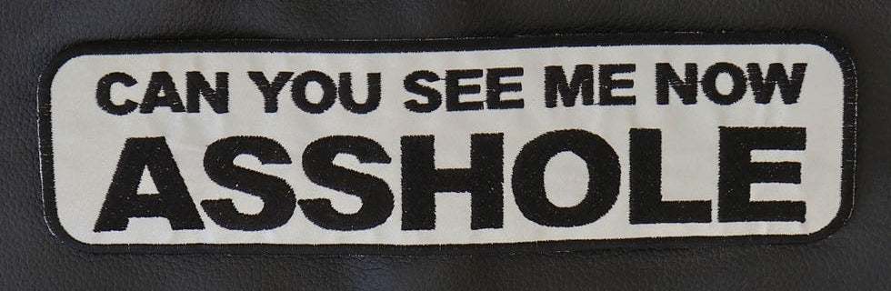 Close-up of Can You See Me Now reflective patch lettering and embroidered border