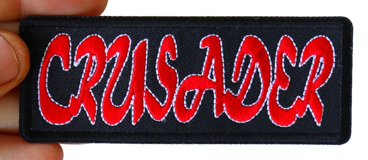 Close-up of red Crusader lettering and black embroidered border