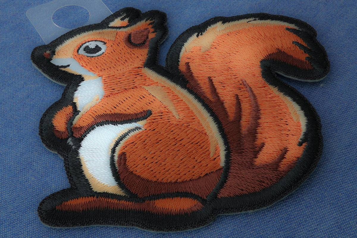 Cute Squirrel Embroidered Patch shown for scale