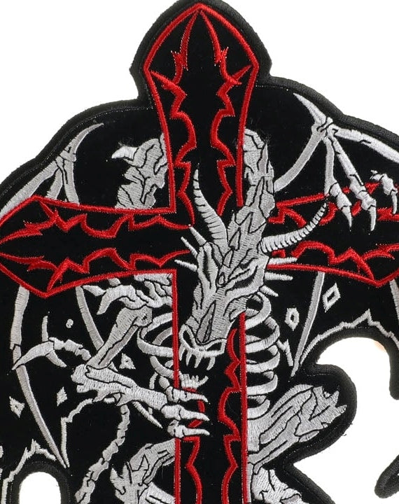 Close-up of dragon skeleton cross patch red, white and black embroidery