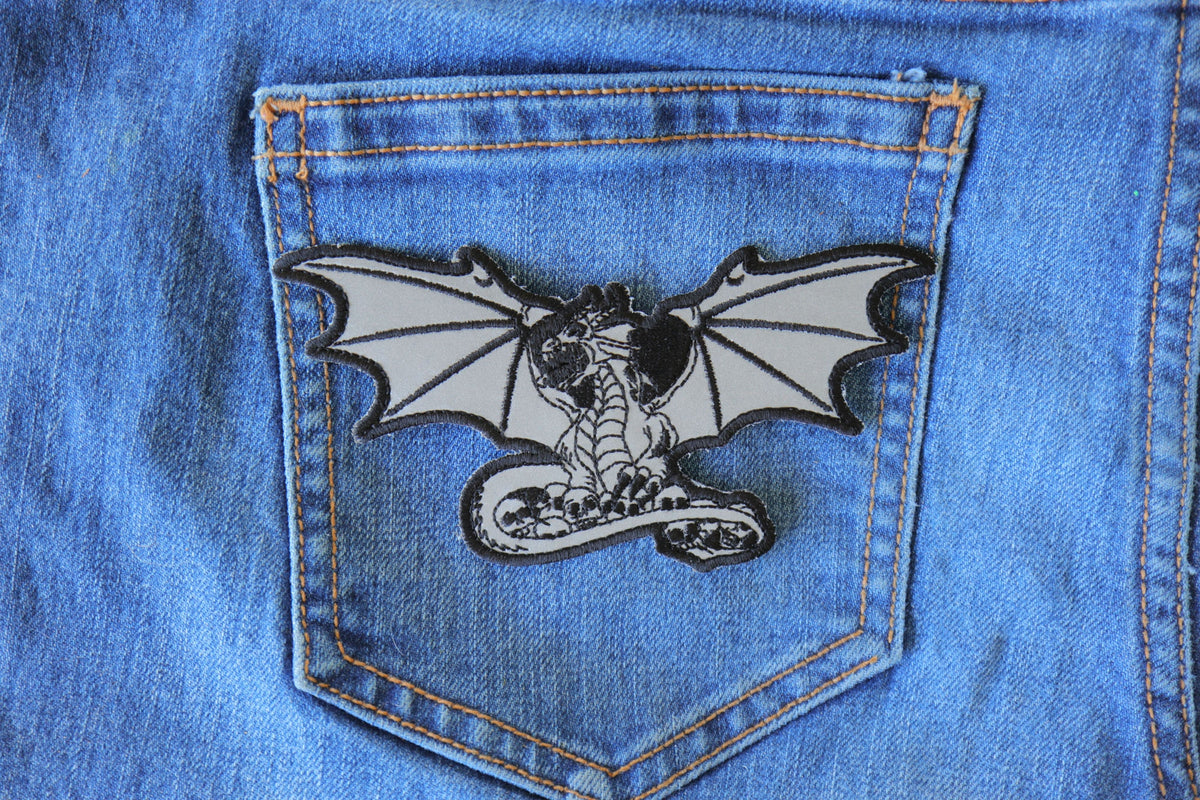 Dragon Skeleton Cross Embroidered Patch shown for scale