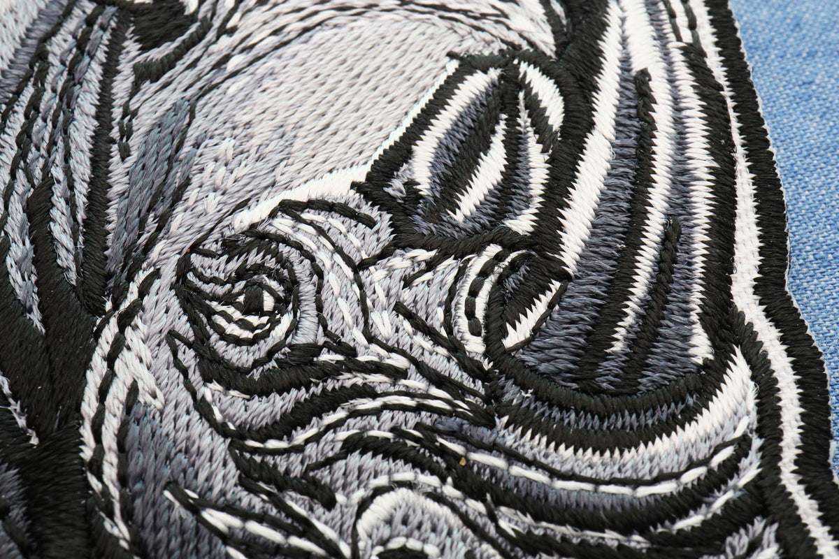 Gray Rhino Embroidered Patch shown for scale