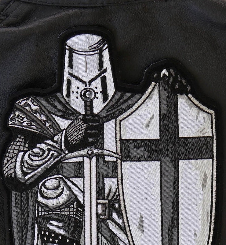 Close-up of crusader knight helmet, shield and armor embroidery
