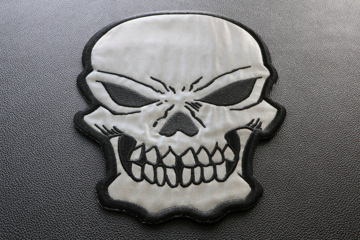Reflective Skull Embroidered Patch shown for scale