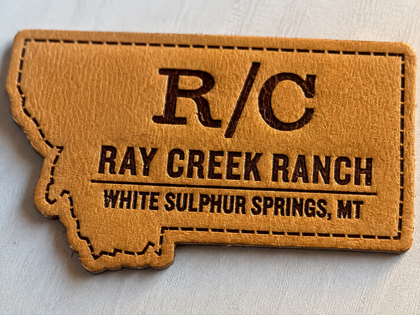Leather patch grain and engraving detail close-up