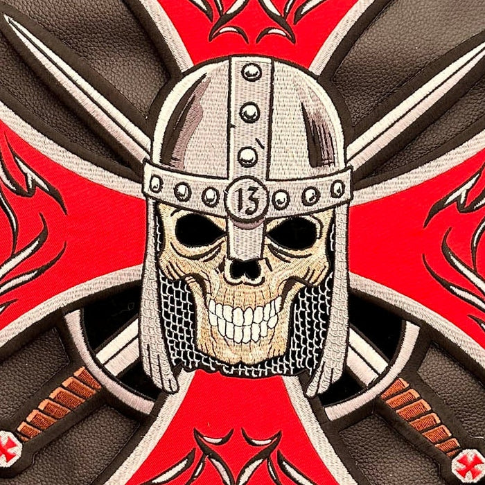 Close-up of Maltese cross skull knight helmet and sword embroidery
