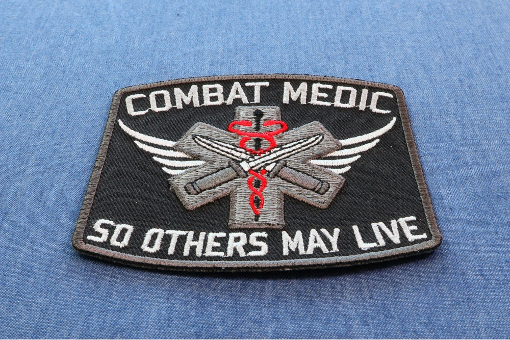 Combat Medic EMT Embroidered Patch shown for scale
