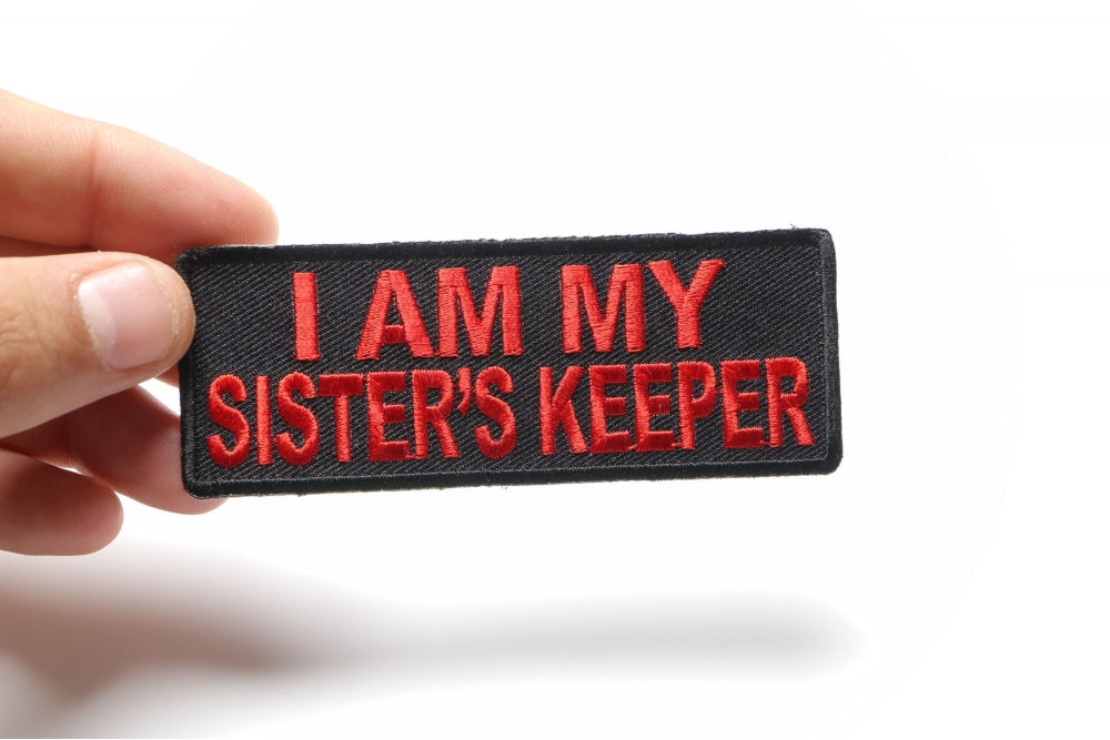 Sister's Keeper Red Embroidered Patch shown for scale