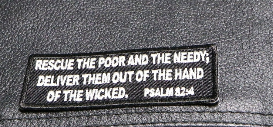 Close-up of Psalm 82:4 embroidered lettering and patch border