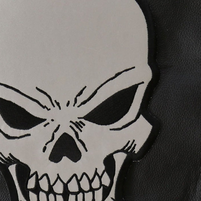 Close-up of reflective skull eye, teeth and black embroidered edge