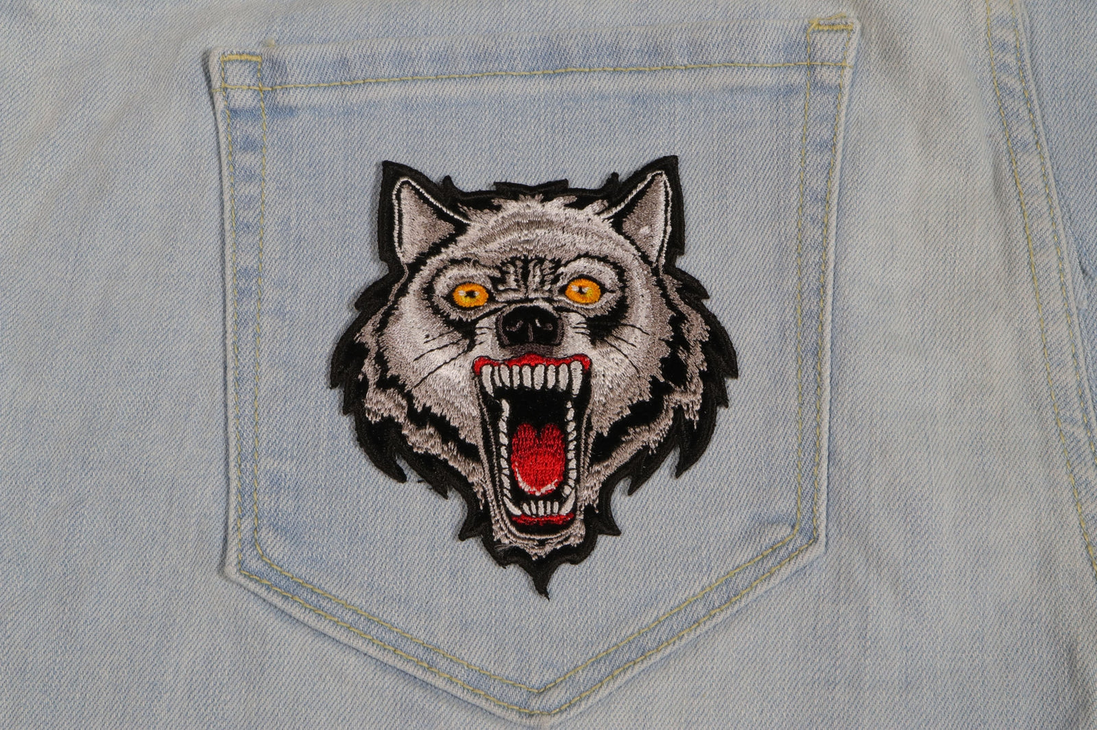 Classic Wolf Embroidered Patch shown for scale