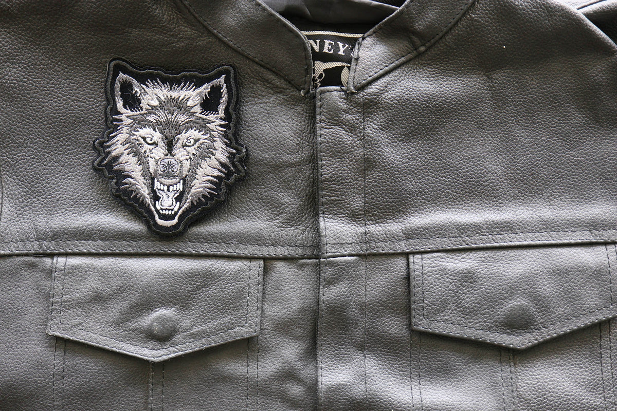 Wild Snarling Wolf Embroidered Patch shown for scale