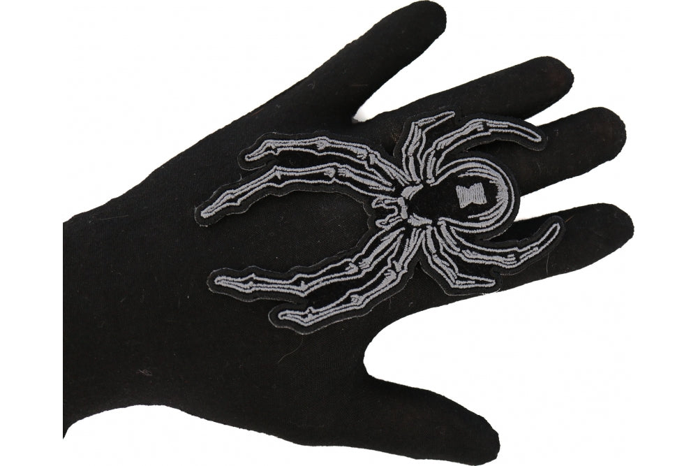 Arachnid embroidered spider patch shown for scale