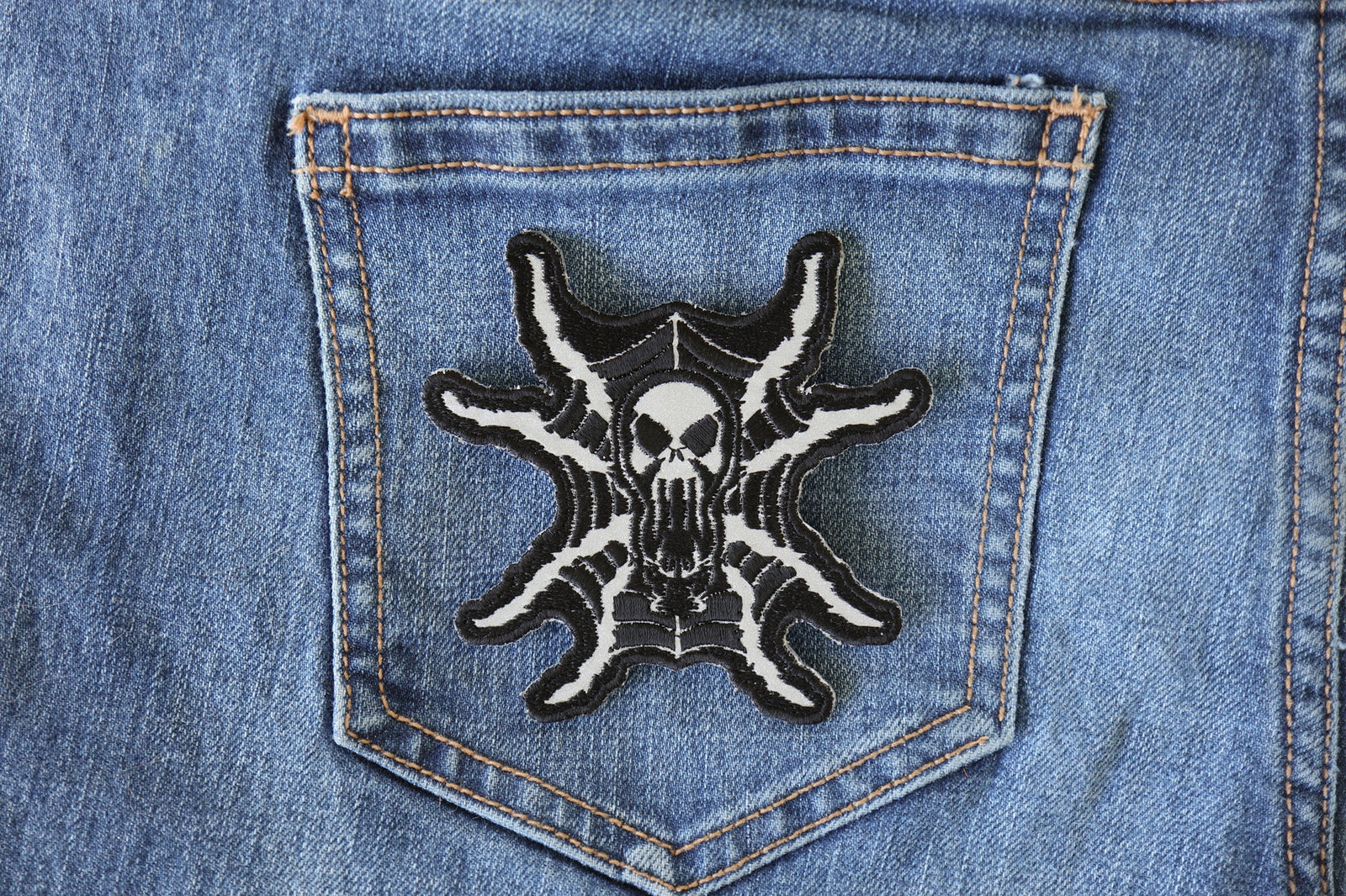 Spider Skull Reflective Embroidered Patch shown for scale