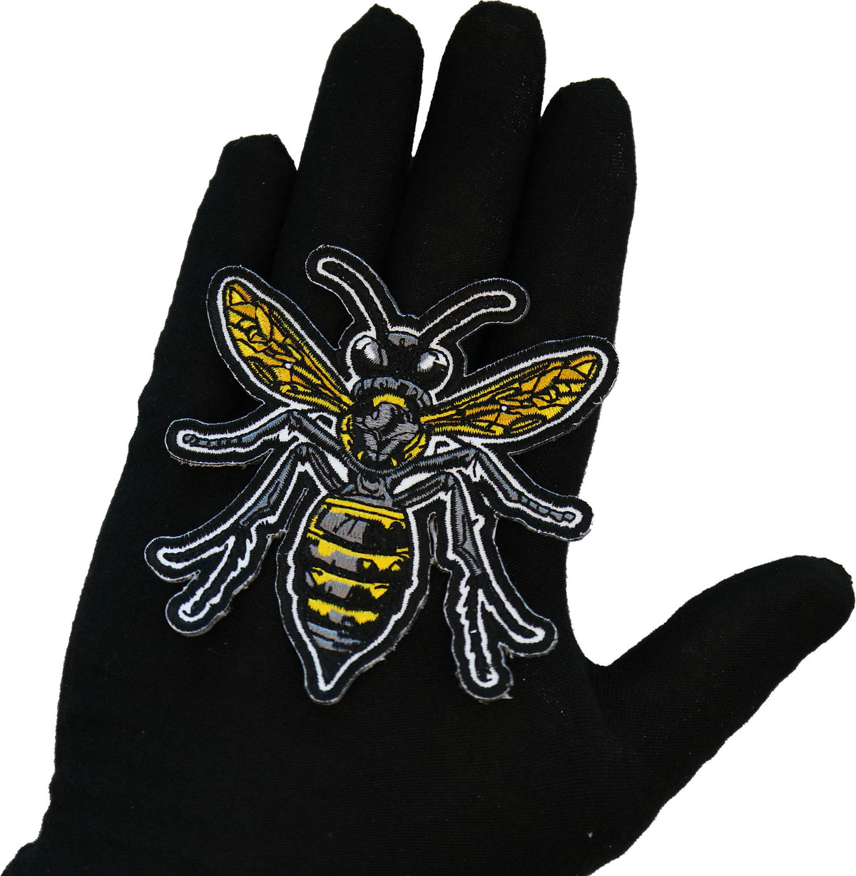 Wasp embroidered patch shown for scale