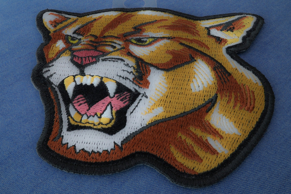 Wild Cougar Embroidered Patch shown for scale