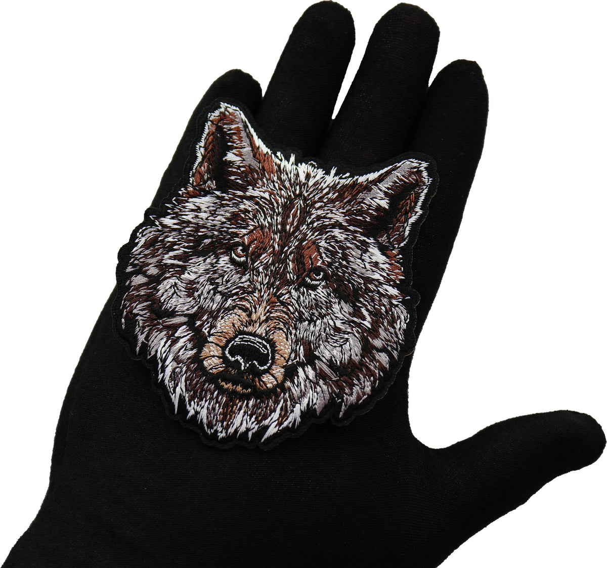 Wolf Embroidered Patch shown for scale